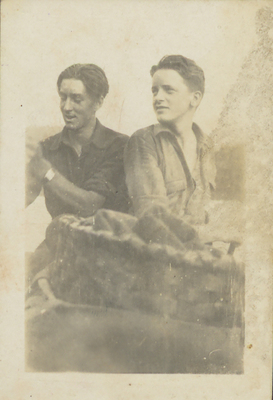 An early photo of Paul Schaefer (left) and Carl Schaefer (right) with a hiking basket in the foreground.