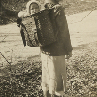 Carolyn Keseberg Schaefer hiking with daughter Mary. Paul Schaefer’s annotation on the back reads: "This is my wife Carolyn about 9 years ago. Start 'em this way at about 10 months. At 3 they're read for an overnight on top of Mt. Marcy. P.S."