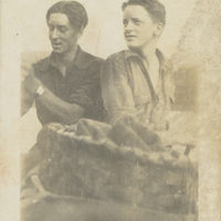 An early photo of Paul Schaefer (left) and Carl Schaefer (right) with a hiking basket in the foreground.