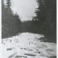 Hundreds of loose logs float down Henderson River damaging the shore line, May 1931. Bill Gluesing and Paul Schaefer took this on a trip to photograph Indian Pass from Henderson Lake.